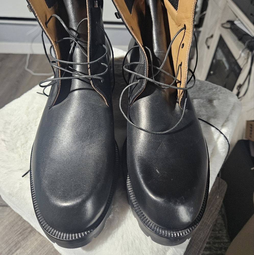 Christian Louboutin’s black patinated calfskin Trapman boot size 43